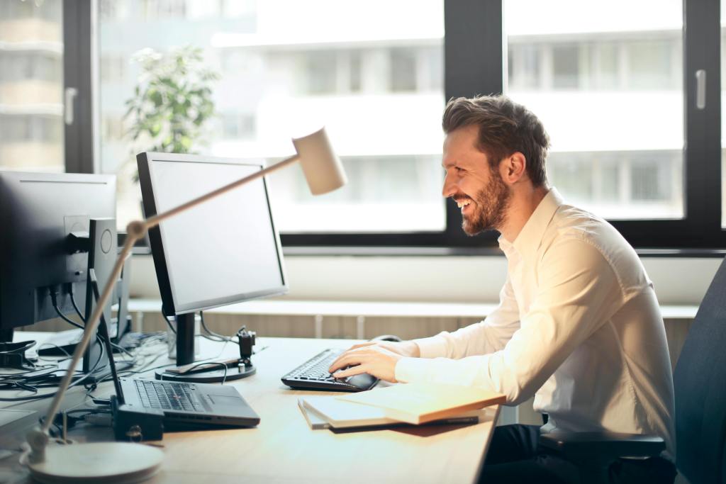 Professional working on a laptop, illustrating PC Management services to optimize IT infrastructure, enhance performance, and ensure seamless operations for businesses in Terre Haute and Plainfield, IN.